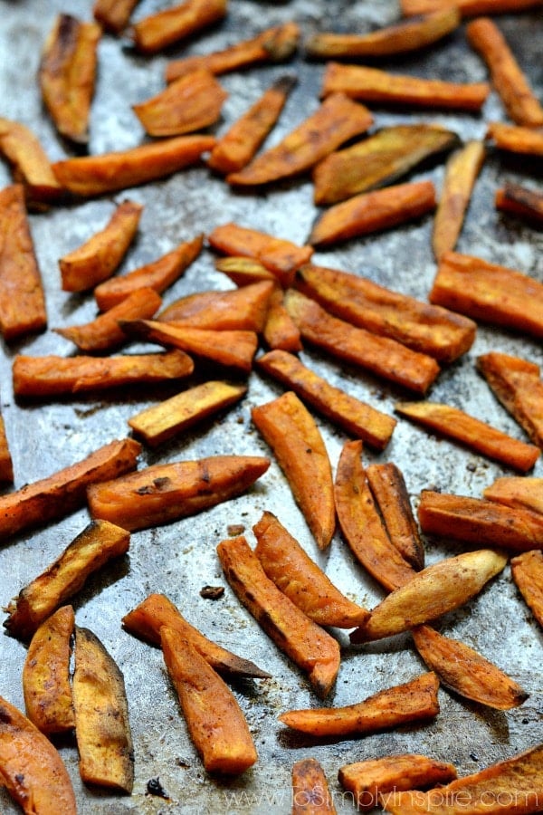A pile of sweet potato fries on a baking sheet