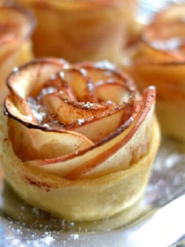 a tray of apple rose puff pastries