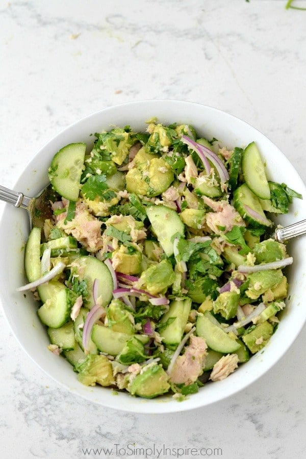 a white bowl of avocado tuna salad