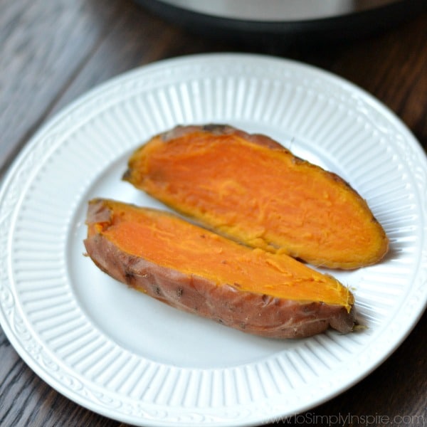 Sweet potato cut open on white plate