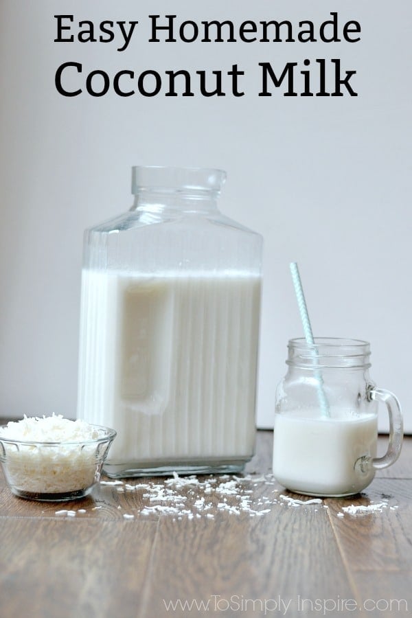 A glass of milk on a table with Coconut milk and a small bowl of shredded coconut