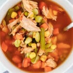 closeup of chicken vegetable soup with carrots, corn and green beans