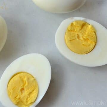 Closeup of cut hard boiled egg with yolk showing