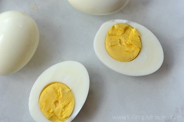 Closeup of cut hard boiled egg with yolk showing