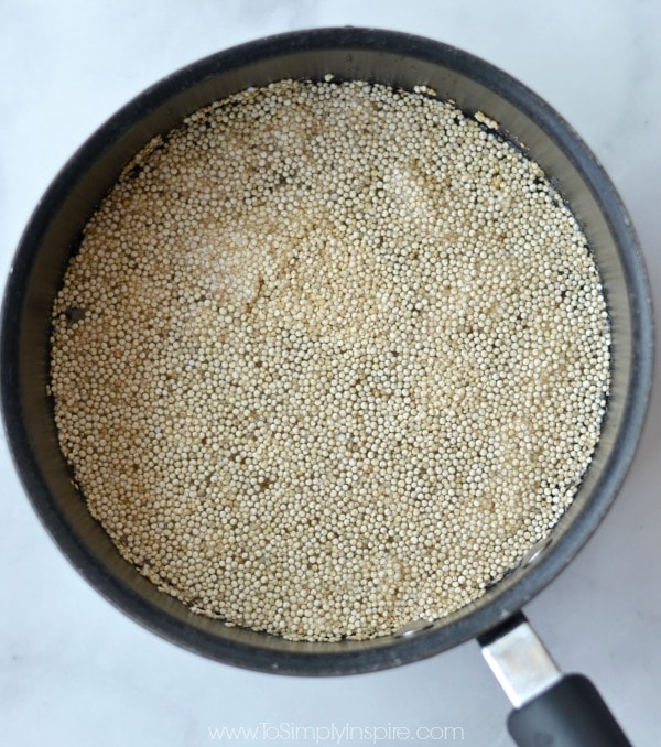 uncooked quinoa in a black pot