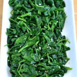 Sauteed Spinach with garlic on a white plate