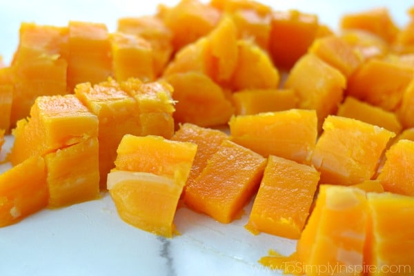 Cubes of butternut squash on a countertop
