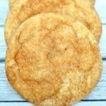 A stack of snickerdoodle cookies on a wooden table.