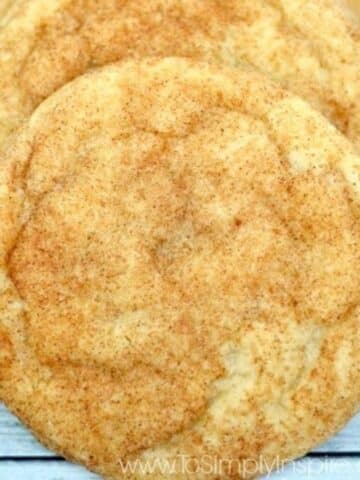 A stack of snickerdoodle cookies on a wooden table.