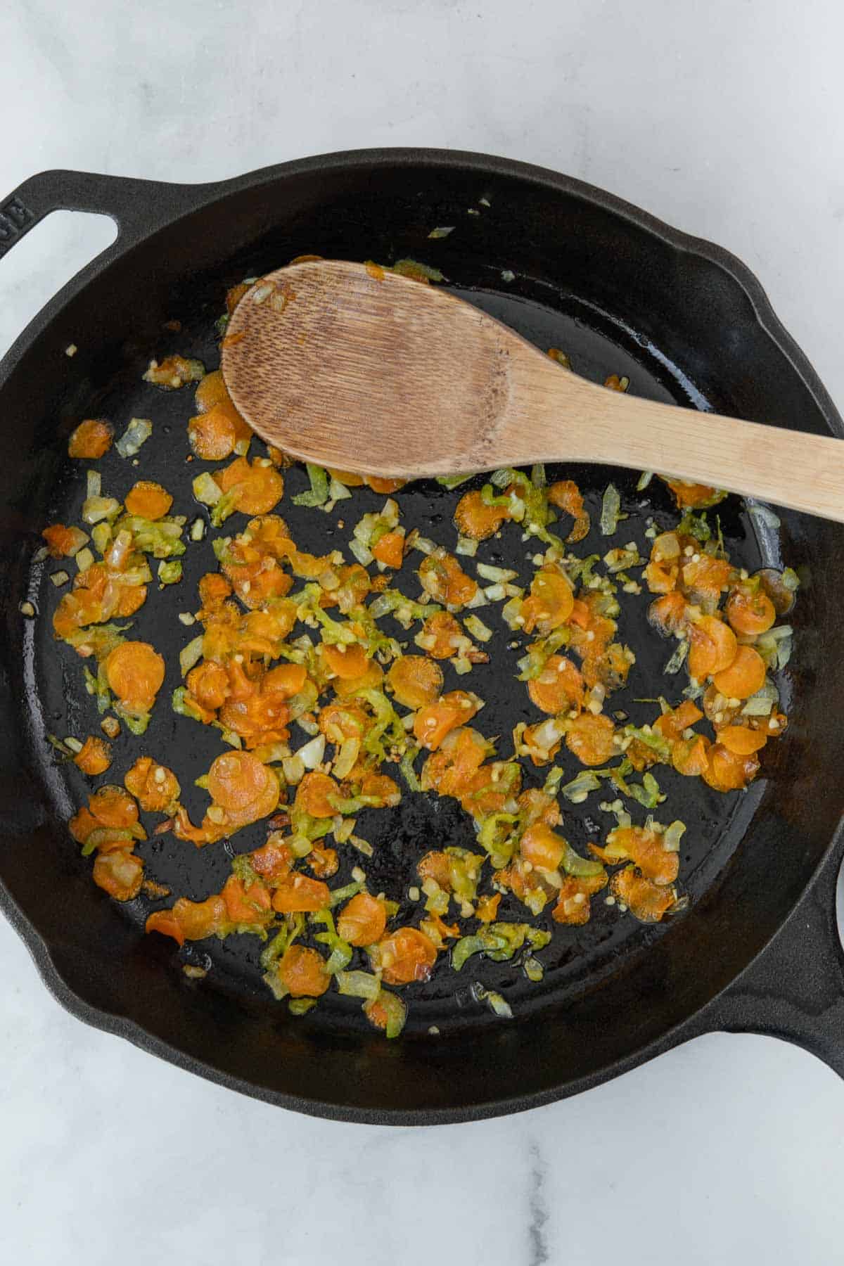 sliced carrots, celery and onions in a pan