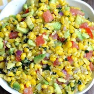 closeup of corn salsa in a white bowl