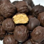 closeup of chocolate covered peanut balls in a pile