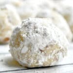 closeup of a snowball cookie covered in powdered sugar