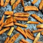 a baking sheet with sweet potato fries.