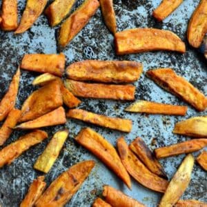 a baking sheet with sweet potato fries.