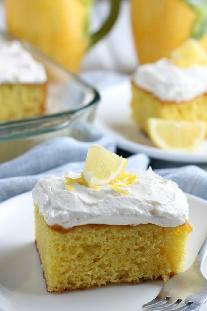 A close up of a slice of lemon cake on a plate