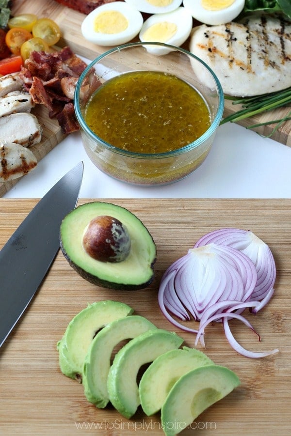  Sliced Avocado and Red Onions on a wood cutting board