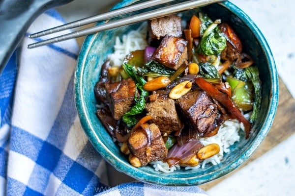 overhead hot of kung pao tofu in a blue bowl