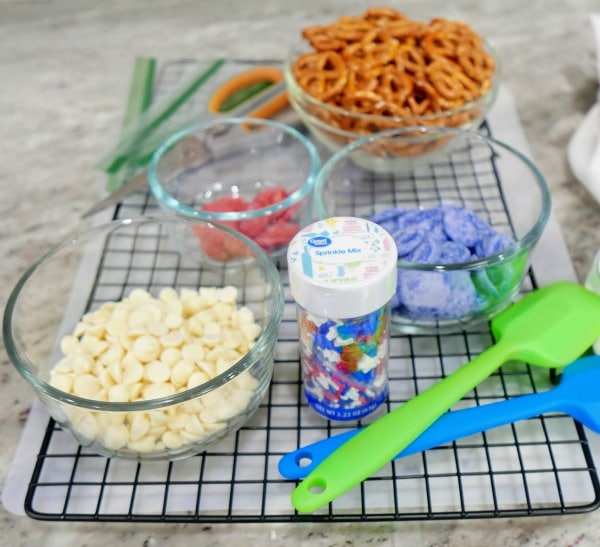 A bowl of food on a table, with Pretzel and Chocolate