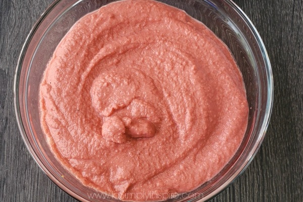 closeup of Beet Hummus in a glass bowl