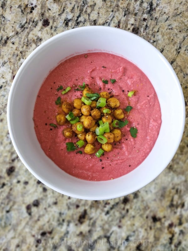 closeup of beet hummus recipe in a white bowl