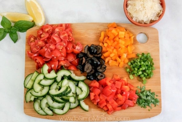 diced vegetables on a wood cutting board