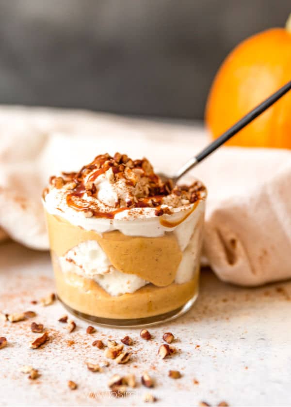 pumpkin cheesecake trifle a glass with a spoon