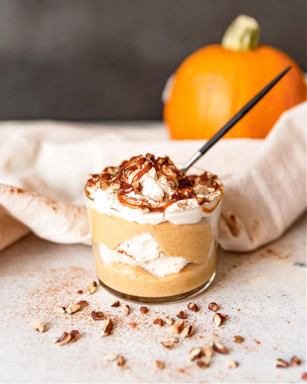 Single serve pumpkin cheesecake trifle with a spoon