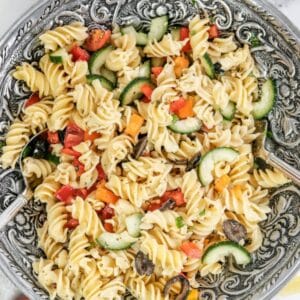 italian pasta salad with rotini pasta, cucumbers, tomatoes, red peppers and olives
