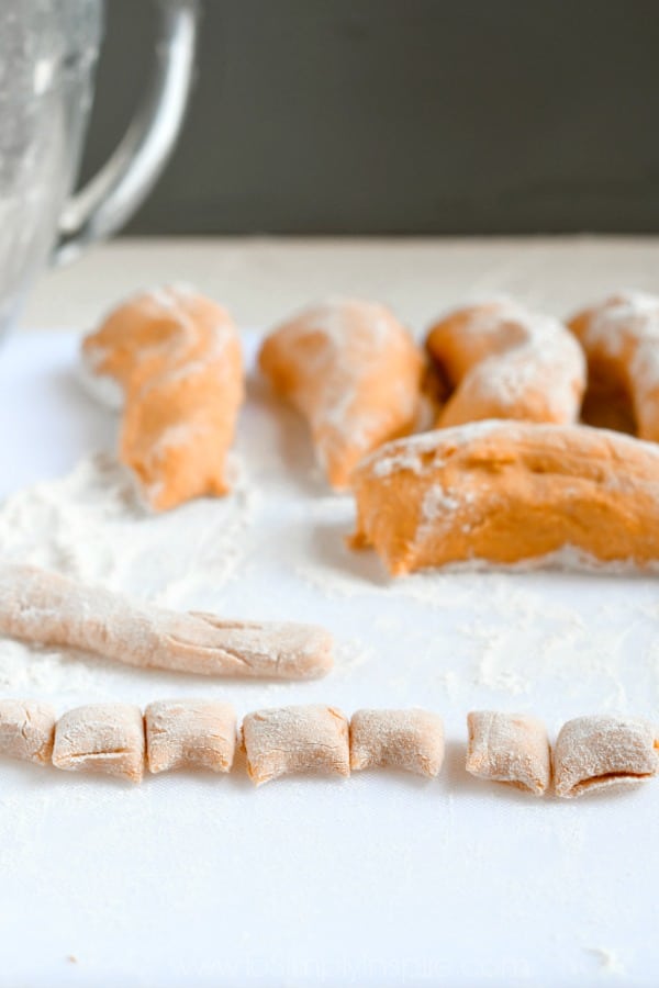 sweet potato gnocchi dough rolled out and covered in flour