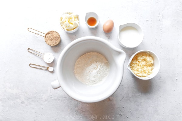 several ingredients in bowls and measuring cups for scones recipe 