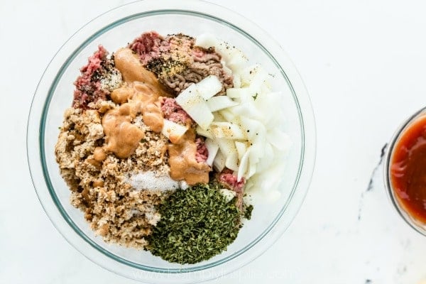 ingredients for meatloaf in a glass bowl