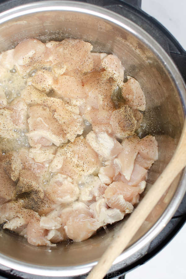 raw chicken cooking in an Instant Pot