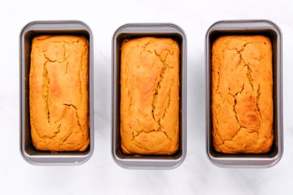 three loaves of sweet potato bread in pans