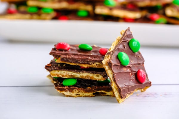 a stack of three pieces of saltine toffee