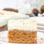 a slice of gingerbread cake with cream cheese frosting