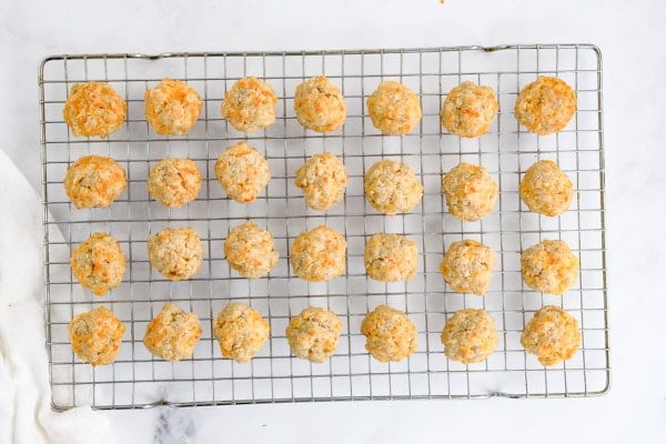 a wire cooling rack full of sausage balls