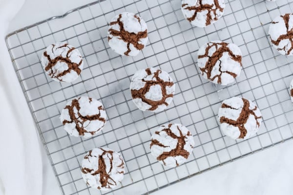 a wire rack with nine a wire rack with nine chocolate crinkle cookies