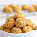 a white bowl full of bisquick sausage cheese balls