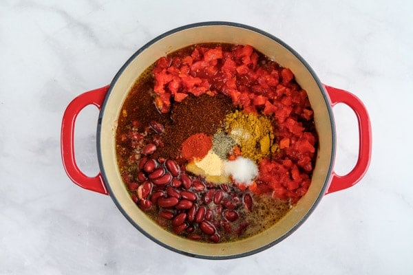 diced tomatoes, kidney beans and spices added to a big pot