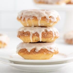 closeup of a stack of three vanilla glazed donuts