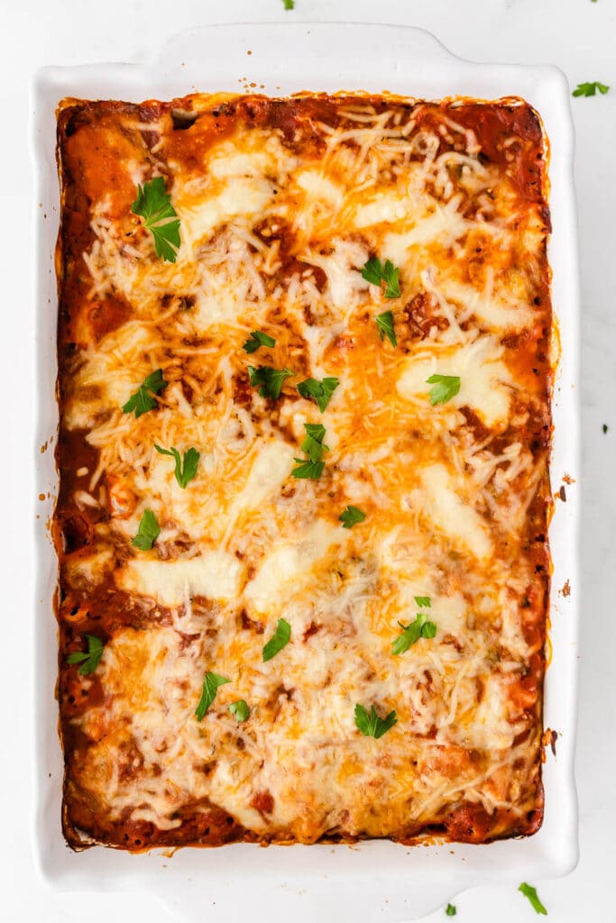 a white casserole dish with baked ziti