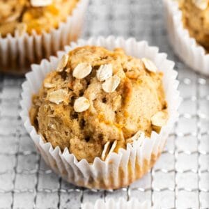 closeup of a banana carrot muffins on a wire cooling rack