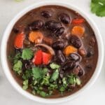black bean soup in a white bowl