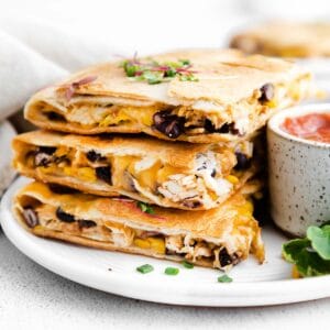 a stack of three quesadillas filled with chicken, black beans and cheese
