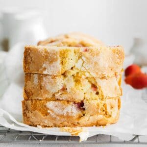 closeup of a stack of three slices of pound cake on a wire rack