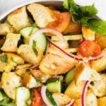 classic panzanella salad with bread, tomatoes, onion and cucumbers.