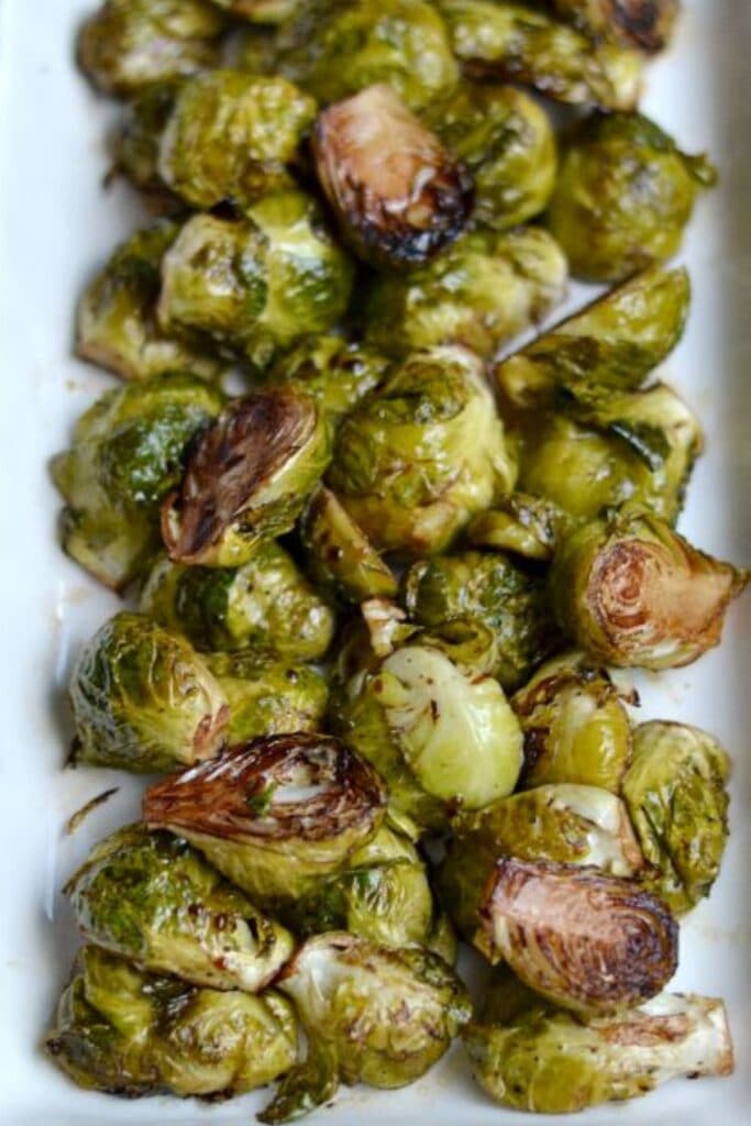 roasted brussel sprouts with balsamic on a white plate