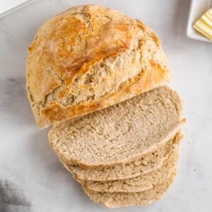 loaf of sourdough bread with 4 slices cut