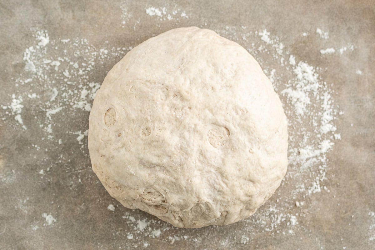 bread dough on floured surface